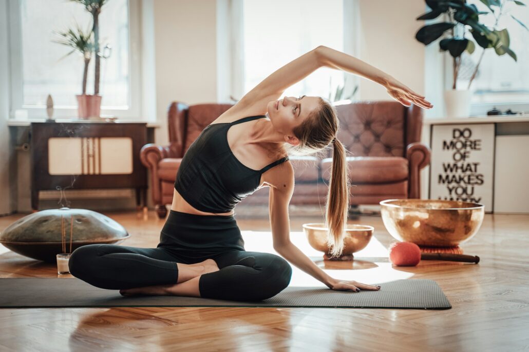 Yoga asanas Relaxed caucasian woman doing yoga at home in daytime
